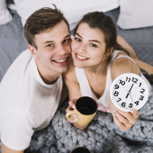 coffee,love,house,hand,camera,man,clock,home,happy,clothes,square,couple,white,coffee cup,drink,cup,bed,morning,together,young