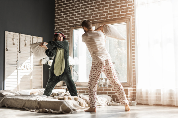 people,man,home,wall,room,couple,white,window,curtain,bed,fun,lady,bedroom,fight,married,female,young,wedding couple,happy people,pillow