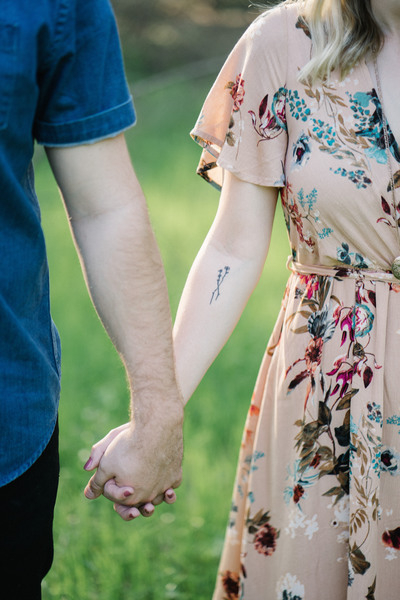 people,couple,holding hands,man,woman,green,grass,blur