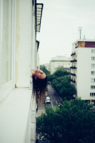 field,outdoor,fog,girl,woman,female,pink,sweet,food,woman,female,head,long hair,hang,model,pose,face,building,city,urban,balcony,public domain images