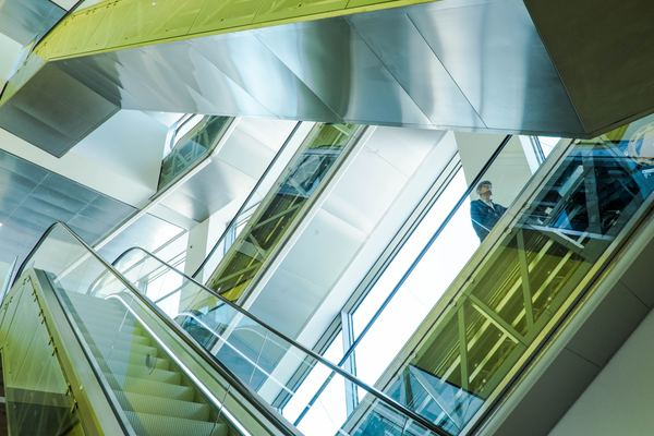 glass,architecture,building,color,woman,abstract,stair,architecture,staircase,escalator,person,glass,stairs,looking up,metal,architecture,building,modern design,tech,technology,green