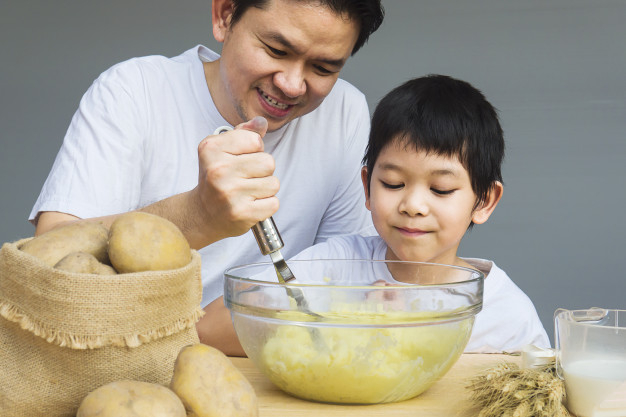 mashed,happily,cooked,prepared,mash,creamy,making,son,potatoes,daddy,make,cuisine,vegetarian,gourmet,meal,asian,warm,year,potato,dad,dish,bowl,wood table,wooden,healthy food,happy family,funny,gray,father,fun,help,thai,vegetable,healthy,boy,cooking,white,milk,happy,table,kitchen,family,food