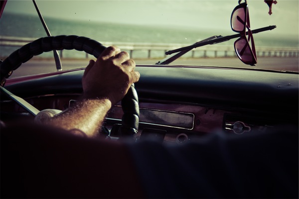 driving,steering wheel,dash,sunglasses,windshield,car,hand