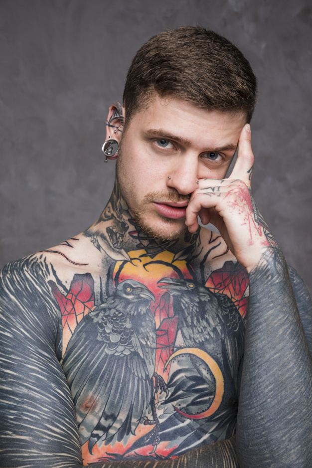 Free: Serious shirtless young man with tattoo on his body looking at camera  Free Photo - nohat.cc