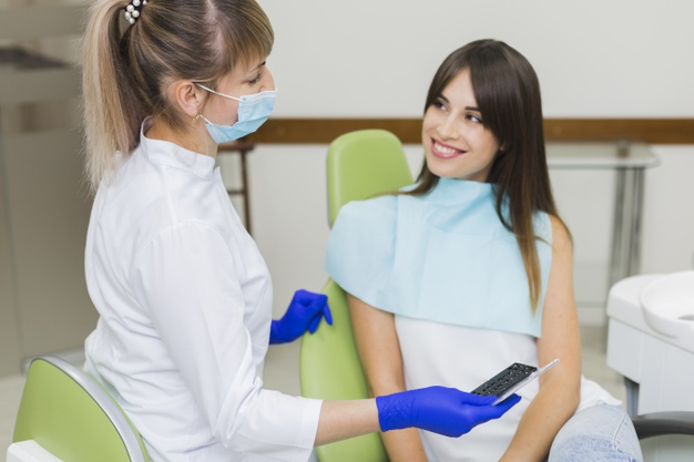 practitioner,orthodontist,surgical gloves,front view,each,females,oral hygiene,side view,stomatology,surgical,oral,defocused,side,surgeon,front,looking,smiling,technician,horizontal,dentistry,hygiene,medic,gloves,patient,view,dentist,dental,medicine,women,happy,smile,health