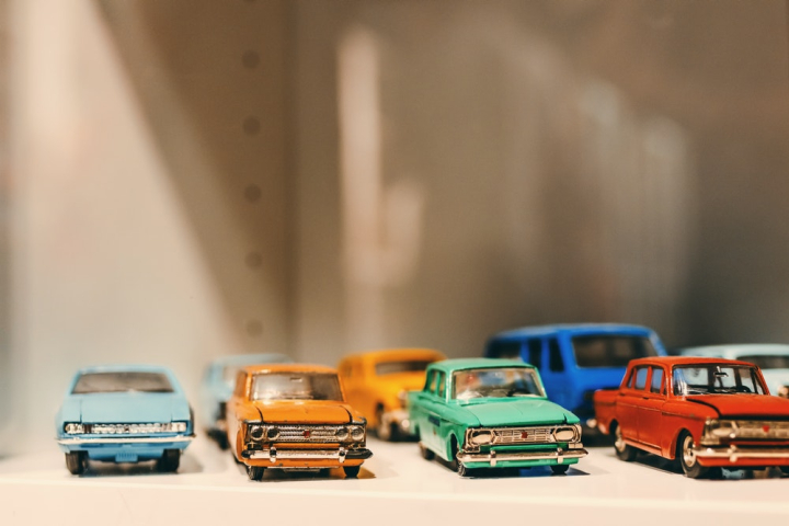 automobiles,blurred background,bumpers,cars,chrome,close-up,collections,design,front,headlights,hobby,little,metal,models,objects,old car,red,small,style,toy car,toys,transportation system,vehicles,wheels,windshield
