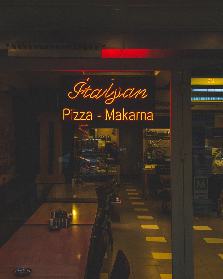 architecture,bar,business,city,commerce,design,eat,evening,film photography,food,group,illuminated,indoors,led lights,light,neon sign,night,pizza,pizzeria,restaurant,signage,stock,travel