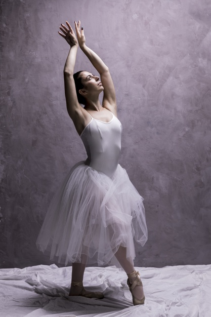 Ballerina posing in dance hall Stock Photo by ©bezikus 177032970