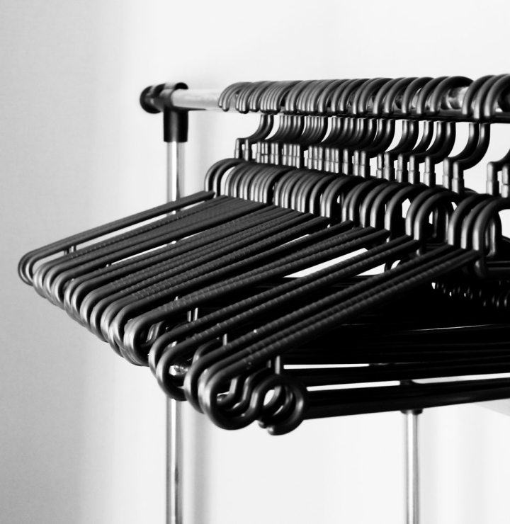 black and-white,blur,business,chrome,close-up,clothes hangers,clothes rack,clothing rack,contemporary,display,fashion,focus,grayscale,hanger,hangers,hanging,indoors,modern,monochrome,orderly,row,service,shop,shopping,steel,stock,store,style,wardrobe