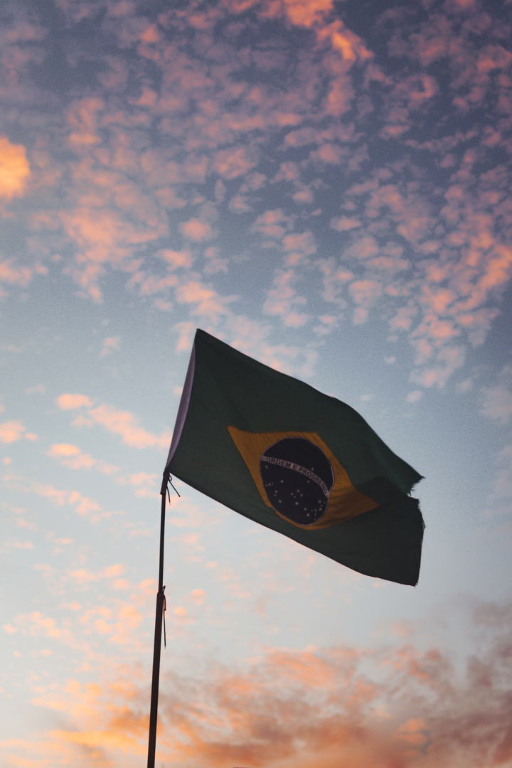 brazilian flag,bright,clouds,flag,flag pole,flagpole,freedom,golden,h,low angle photography,outdoors,patriotism,people,summer,sun,sunset,symbol,travel,wind,windy