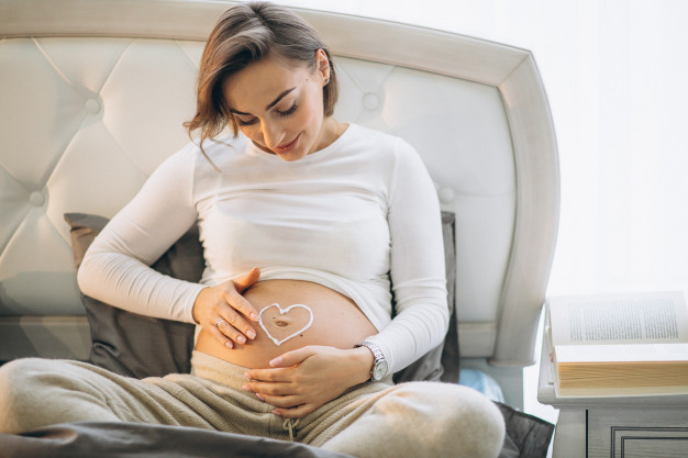 Free Pregnant Woman Applying Cream On The Belly To Prevent Stretches Free Photo Nohatcc 