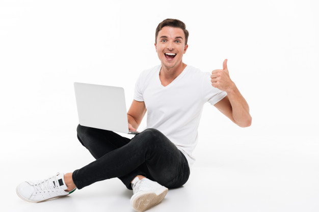 gesturing,satisfied,agree,attractive,confident,handsome,freelance,occupation,adult,guy,male,positive,thumb,achievement,sitting,professional,young,finger,app,winner,success,businessman,person,internet,web,work,happy,smile,laptop,student,man,computer,hand,technology,people,business