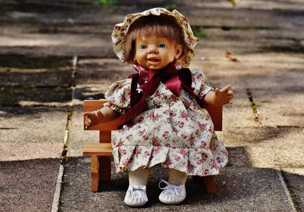 wooden bench,toy,toddler,sweet,smile,play,little,kid,innocence,happy,happiness,girl,funny,doll,cute,concrete floor,child,baby
