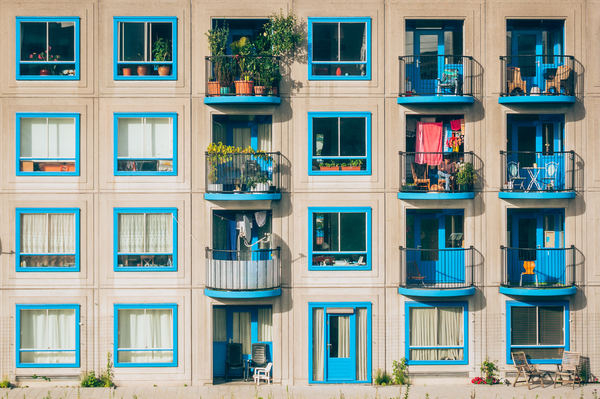 architecture,buildings,residential,apartment,condominium,windows,balconies,lines,shapes,patterns,minimalist,blue,white