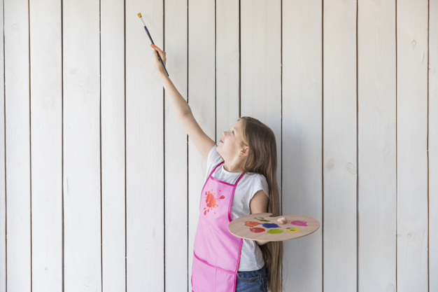 waistup,one,innocence,indoors,trying,innocent,elementary,raised,long,playful,little,blonde,casual,leisure,childhood,smiling,pallet,plank,holding,hobby,palette,arm,apron,happiness,painter,artist,paintbrush,wooden,painting,person,board,white,child,kid,wall,happy,smile,color,art,brush,home,hair,paint,girl,line,education,house,wood,people