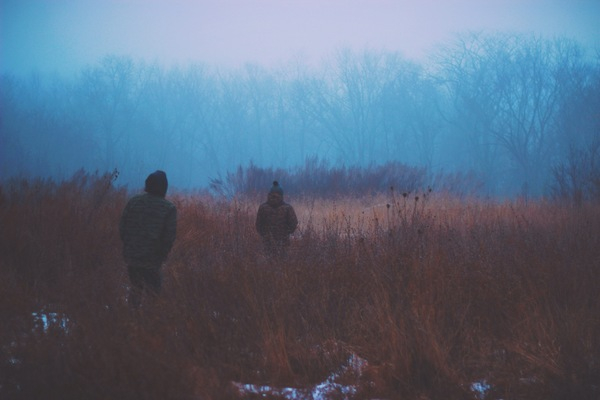 dark,fog,winter,cold,snow,coats,jackets,people,woods,trees,outdoors,haze,toque,bushes