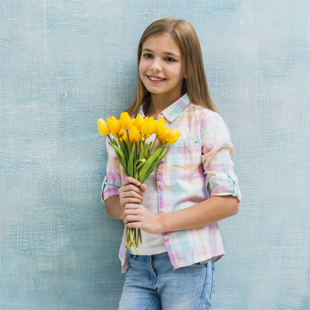 one,leaning,innocent,freshness,bunch,joyful,little,cheerful,small,blonde,casual,single,childhood,standing,looking,smiling,pretty,tulips,alone,holding,lifestyle,portrait,beautiful,happiness,tulip,female,sweet,person,backdrop,yellow,human,child,kid,happy,smile,cute,beauty,girl,blue,fashion,camera,children,hand,people,flower,background