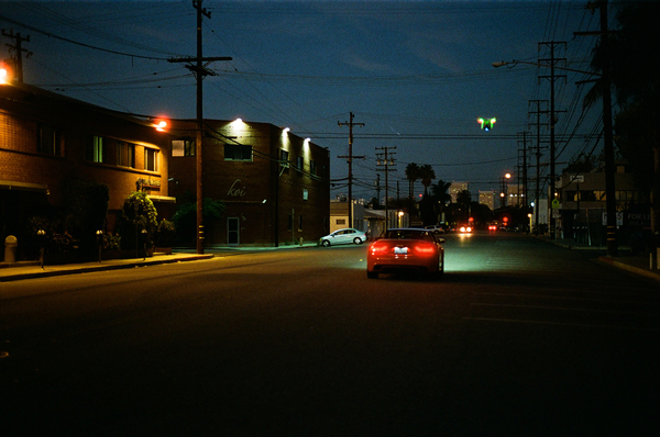red,car,lights,dark,street,power lines,road,night,evening