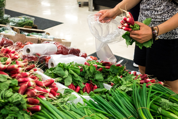 grocery store,hands,radishes,vegetables