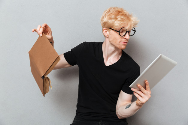 aside,concentrated,caucasian,attractive,blonde,casual,handsome,standing,looking,adult,guy,pocket,male,arm,read,portrait,cool,young,relax,youth,reading,tablet,person,glasses,human,network,student,man,computer,people