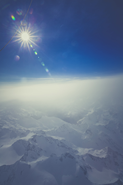 nature,landscape,mountains,snow,summit,peaks,aerial,stratosphere,sky,clouds,sun,solar,flare,blue,white
