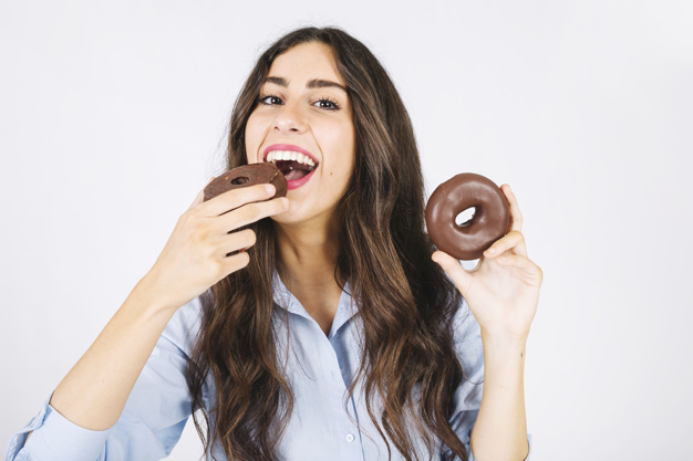 food,face,smile,sweet,eat,donut,female,young,good,donuts,delicious,smiling,looking,tasty,joyful,good looking,with