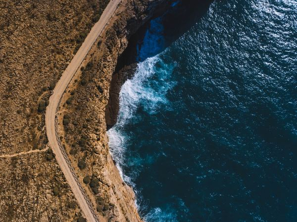 nature,forest,blue,beach,sea,shore,above,view,top,drone view,aerial view,water,cliff,road,ocean,sea,shore,coast,wave,abstract,looking down