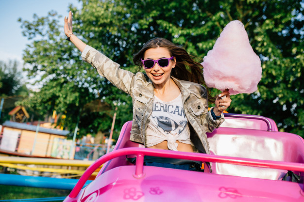 food,children,summer,spring,candy,park,sweet,fun,sunglasses,urban,outdoor,eating,young,jacket,snack,cotton,entertainment,sitting,weekend,joy