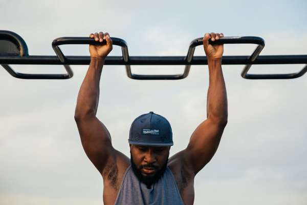 25-30 year old,adult,african,fit,one person,outdoors,sport,urban setting,active lifestyle,activity,african american ethnicity,bearded,chin ups,chin-up,exercising,fitness,health,health club,healthcare,healthy,healthy living,lifestyle,lifestyles,man,muscles,muscular,person,physical fitness,power,pull ups,selective focus,sports training,strength,training,up,view from front,working out