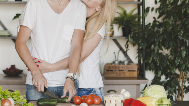 people,house,hand,man,kitchen,hair,home,vegetables,couple,board,plant,organic,help,stand,tomato,romantic,female,knife,young,holding hands