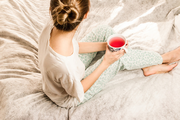 woman,bed,drink,tea,food,pyjamas,red,pop,juice,feet,hair