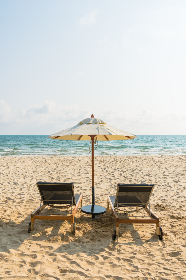 shore,coast,chairs,paradise,sunny,relax,sand,island,vacation,tourism,bed,chair,ocean,umbrella,white,tropical,landscape,sky,sun,sea,beach,blue,summer,water,travel