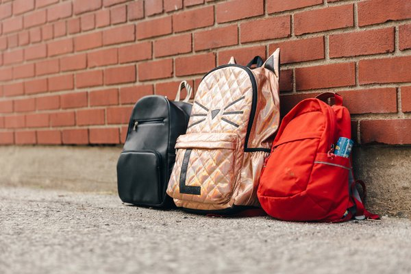 school,education,backpacks, brick wall