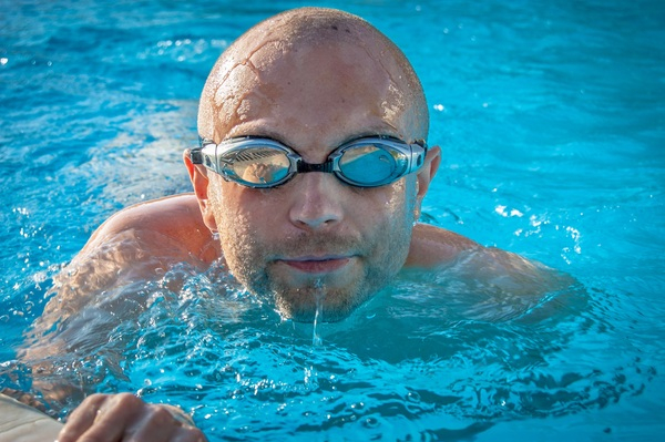 wet,water sports,water,swimming pool,swimming,swimmer,person,man,leisure,goggles,bald