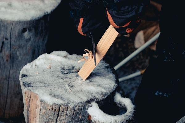 odd job,art,paint,artisan,work,hand,wood,architecture,building,wood,log,cold,snow,person,knife,hand tool,wood work,whittling,wood carving,carve,work