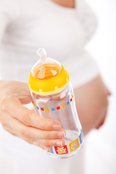 woman,pregnant,pregnancy,person,motherhood,maternity,holding,hand,expecting,belly,baby bottle