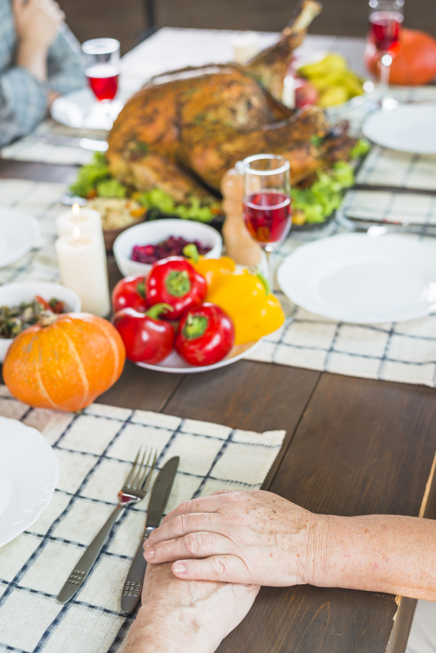food,hand,family,thanksgiving,table,home,wine,celebration,holiday,event,couple,glass,meat,turkey,plate,vegetable,dinner,together,wine glass