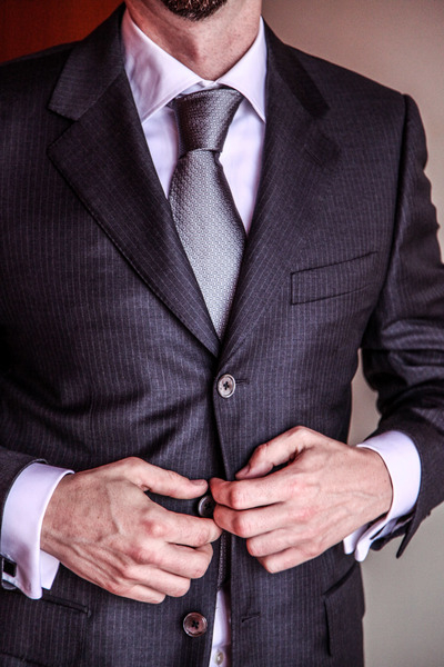 suit,garment,business,clothing,businessman,male,man,necktie,jacket,professional,corporate,windsor tie,people,person,adult,job,work,executive,office,tie,caucasian,covering,portrait,success,men,consumer goods,successful,confident,handsome,worker,smile,happy,neckwear,manager,standing