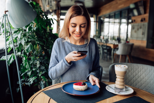 food,coffee,technology,restaurant,phone,cake,hands,table,mobile,smile,happy,photo,cafe,digital,time,smartphone,coffee cup,cup,breakfast,sweet