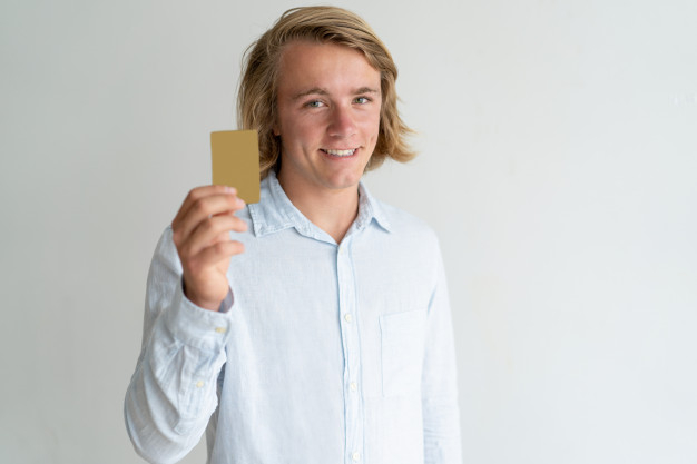 card,hand,man,hair,face,happy,shirt,person,white,bank,credit card,model,customer,studio,young,fair,holding hands,plastic
