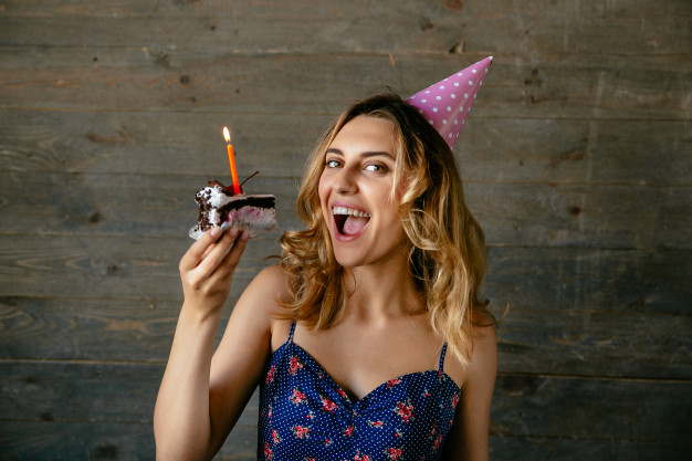 food,birthday,happy birthday,cake,hair,chocolate,face,smile,happy,holiday,person,happy holidays,hat,candle,birthday cake,sweet,mouth,dessert,eat,lady