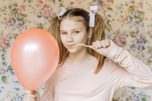 ribbon,people,hand,camera,girl,beauty,pink,wallpaper,cute,kid,balloon,child,person,eyes,fun,fork,life,grey,stand,female,young,pop,pink ribbon,burst,holding hands,portrait,up,problem,cute girl,lifestyle,fragile,look,pretty,looking,childhood,hold,front,casual,trouble,blonde,small,little,ponytail,destruction,waist,innocent,breakdown,adorable,closeup,selective,indoors,popping,innocence,mischief,waist up,with