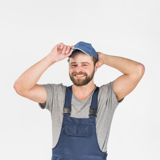 square format,looking at camera,studio shot,putting,foreman,laborer,posing,overall,joyful,brunette,format,confident,cheerful,repairman,handsome,standing,wear,looking,smiling,technician,occupation,shot,adult,holding,guy,plumber,male,positive,construction worker,square background,background white,professional,uniform,young,modern background,studio,engineer,mechanic,cap,service,head,background blue,beard,modern,worker,job,person,white,square,clothes,happy,white background,construction,blue,man,camera,blue background,background