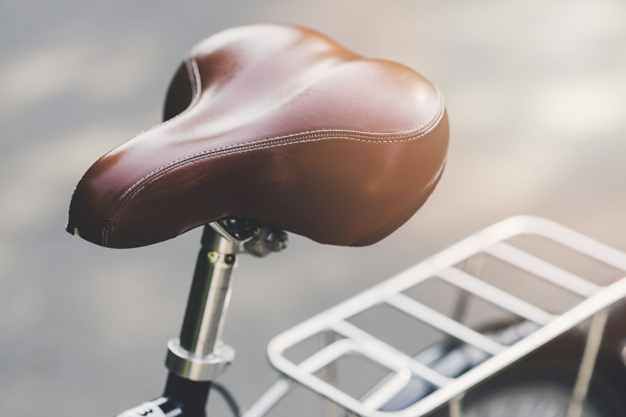 pattern,travel,bike,metal,bicycle,shape,new,transport,support,brown,leather,transportation,traditional,steel,vehicle,focus,day,close,metallic,seat