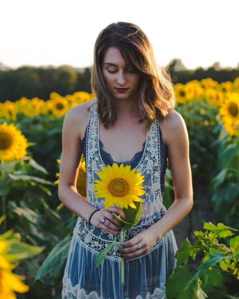 person,woman,girl,person,woman,man,sunflower,flower,yellow,woman,lady,female,dress,summer dress,hold,holding,sunflower,field,sunflower field,portrait,ring