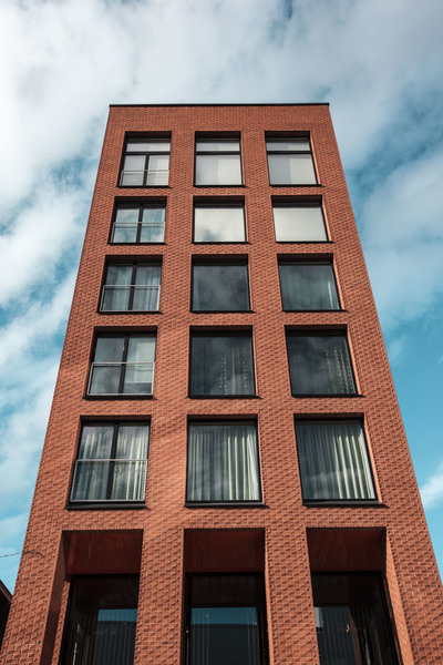 apartment,architecture,blue,blue skies,blue sky,brick,brick wall,building,business,clouds,construction,contemporary,expression,exterior,facade,glass items,modern,modern architecture,Modern building,office,outdoors,red,reflection,tallest,urban,windows,Free Stock Photo