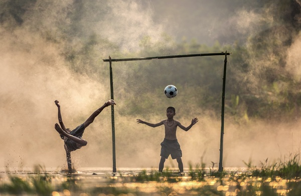 children,football,asia,kick,ball,river,goal,soccer,mist,fog,warm,overhead,strike,goalkeeper,striker,forward