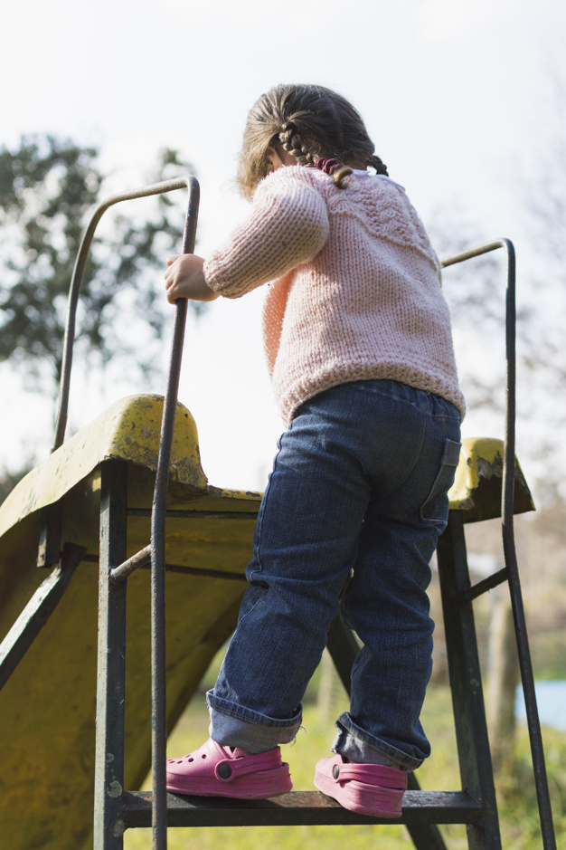 people,cute,garden,kid,metal,child,human,person,park,clothing,play,stand,childrens day,balance,kindergarten,jeans,kids playing,female,back,ladder