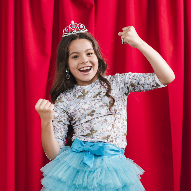 people,crown,beauty,red,cute,smile,happy,kid,person,stage,winner,dress,mouth,curtain,open,theatre,happy people,beautiful,bright,cute girl