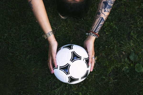  ball,park,grass,sport,sports,soccer,outside,holding, football